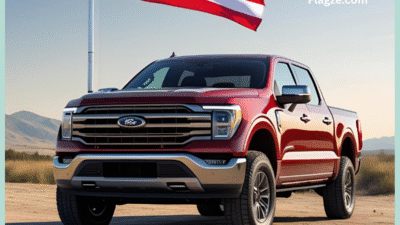 A red pickup truck proudly displaying a large national flag mounted securely on its truck bed, emphasizing the visual impact of a truck flag mount.